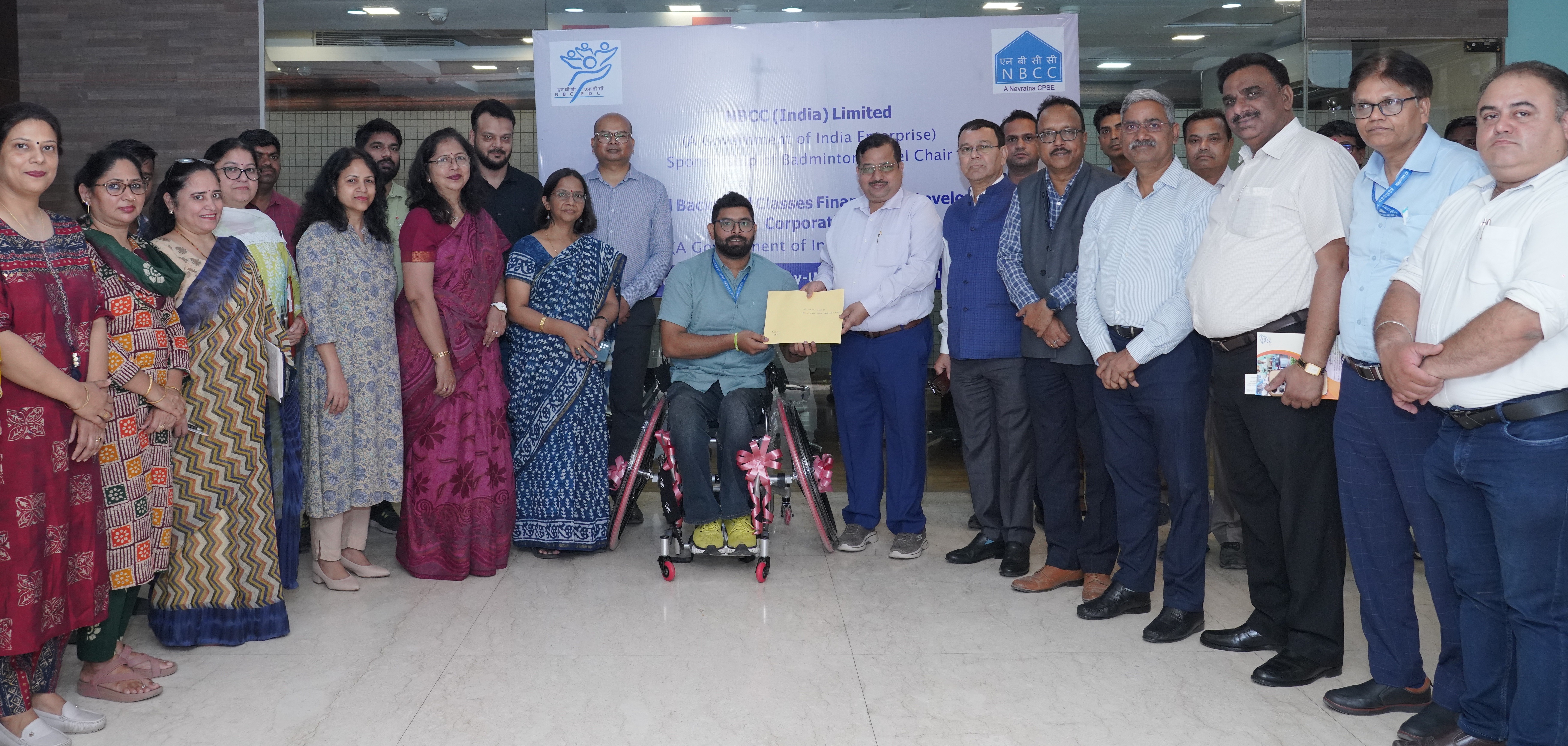 Indian-GRAPEVINE-nbcc-strengthens-its-csr-outreach-by-providing-specialized-wheelchair-to-para-badminton-athlete-munn